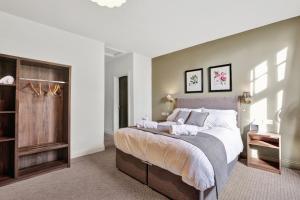 a bedroom with a large bed in a room at The Lambton in Durham