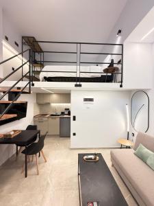 a living room with a loft bed and a couch at Room8 Suites in Thessaloniki