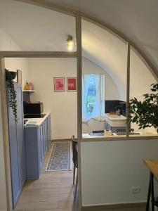 a kitchen with an arched window in a room at Casa Eva in Dolceacqua +14 photos