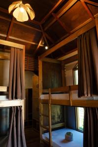 Ένα ή περισσότερα κρεβάτια σε δωμάτιο στο Kayan Siargao