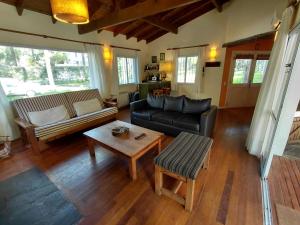 a living room with a couch and a table at Casa grande Carilo in Carilo +23 photos