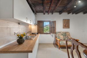 a kitchen with a sink and a counter top at La Generosa in Arona