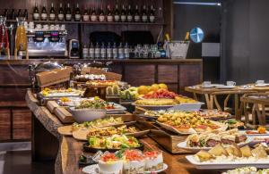 a buffet line with many different types of food at Axel Hotel Barcelona - Adults Only in Barcelona