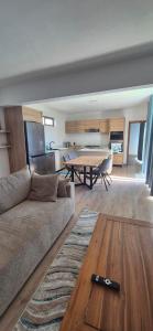 a living room with a couch and a table at Villa Esperenza-3 bedrooms in Flic-en-Flac