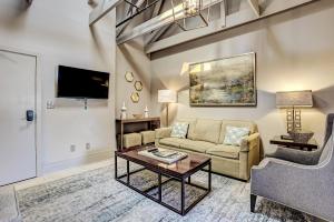 a living room with a couch and a table at Parker's Collection Unit 8 in Savannah
