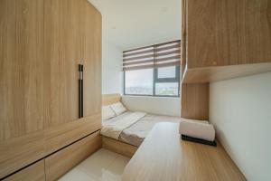 a small bedroom with a bed and a window at Hue Rustic Homestay with Swimming Pool & Gym Room in Thôn Văn Dương +44 photos