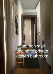 a hallway with a door leading to a kitchen bathroom at Bright & Stylish-Heart of Old City-Experienced Hosts in Bern +43 photos