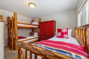 a bedroom with two bunk beds in a house at RMR: Teewinot C3 Condo in Teton Village in Teton Village +12 photos