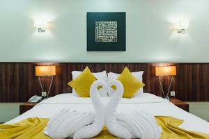 Ένα ή περισσότερα κρεβάτια σε δωμάτιο στο VERTA Almahbas Hotel +44 φωτογραφίες