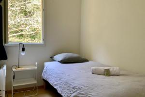 a small bedroom with a bed with a window at Les Naïades I49 - 2 bedrooms for 5 people ! in Avène