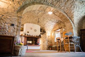 a room with a stone wall and an archway at Acquasalsa in Agnone