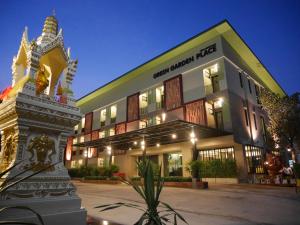 a large building with a sign in front of it at Green Garden Place in Udon Thani