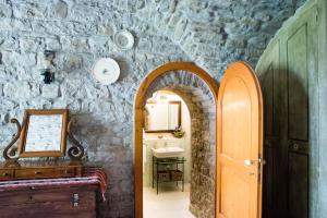 an archway leading to a bathroom with a sink at Acquasalsa in Agnone +54 photos
