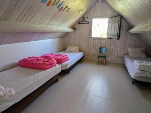 Ένα ή περισσότερα κρεβάτια σε δωμάτιο στο Maison 6pers Guidel Plage