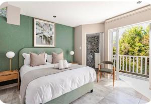 Postel nebo postele na pokoji v ubytování Wellness Guesthouse