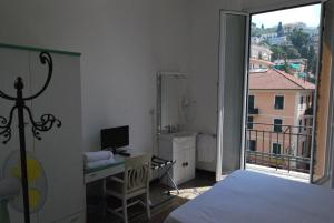 TV a/nebo společenská místnost v ubytování Albergo La Vela