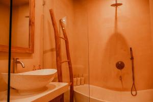 a bathroom with a sink and a shower at Pasir 2 - A stylish 2 bed villa in Bingin w pool in Bingin Beach +15 photos