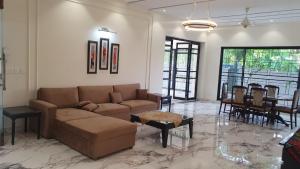 a living room with a couch and a table at 3 bedroom modern house in Lahore