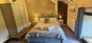 Voodi või voodid majutusasutuse Sienna Cottage toas