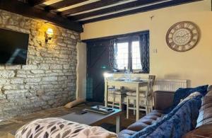 Televiisor ja/või meelelahutuskeskus majutusasutuses Sienna Cottage