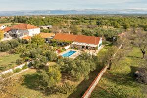 an aerial view of a house with a swimming pool at Villa Zdravko ZadarVillas in Prkos
