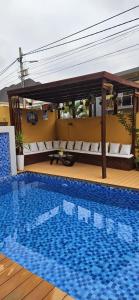 a large swimming pool next to a building at Premium Residence in Maputo