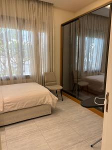 Ένα ή περισσότερα κρεβάτια σε δωμάτιο στο Smart luxury apartment 3bedrooms