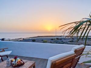 a view of the ocean from the balcony of a villa at Seaside Home Jacuzzi Pool Free Surf Retreat in El Médano
