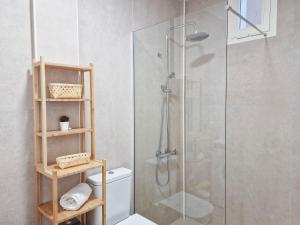 a bathroom with a glass shower with a toilet at Seaside Home Jacuzzi Pool Free Surf Airport Pickup in El Médano +64 photos