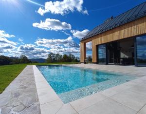 a swimming pool in the backyard of a house at Blacksmith house in Varaždinske Toplice