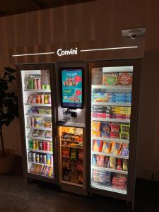 two refrigerators with their doors open with food at Ewa & Maude Hotel in Gothenburg