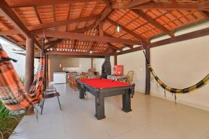 a ping pong table in the middle of a room at Casa no Centro de Pirenópolis in Pirenópolis