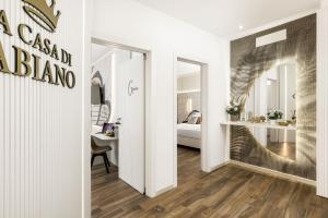 a hallway with a room with a bedroom at La Casa di Fabiano - Self Check-in in Bologna +23 photos