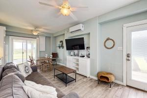 a living room with a couch and a table at Lost Colony Lost Sea Turtle in Port Aransas