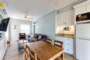 a kitchen and living room with a table and a kitchen and a couch at Lost Colony Lost Sea Turtle in Port Aransas