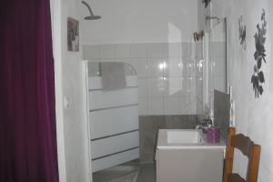 a white bathroom with a sink and a shower at Lou mas li Pitchoun "Le Prunier " in Gordes +38 photos