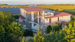 an aerial view of a house with solar panels at Policaretto Rooms by Calabria Stay in Torretta