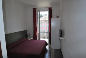 Postel nebo postele na pokoji v ubytování Albergo La Vela