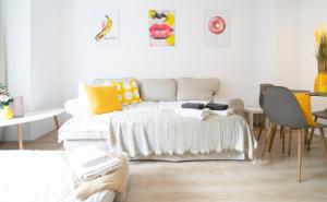 a bedroom with a bed and a table and chairs at NEW! Modernes 2 Zimmer Apartment, Zentral, 6Pers in Essen +24 photos