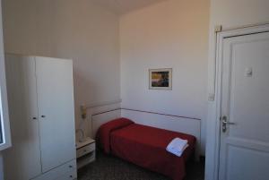 Postel nebo postele na pokoji v ubytování Albergo La Vela
