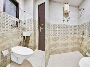 a bathroom with a toilet and a shower at Live on DEL5197 in New Delhi