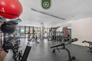 a gym with a lot of treadmills and machines at Oceanfront 2 BR Condo with Beachclub in Cruz de Huanacaxtle
