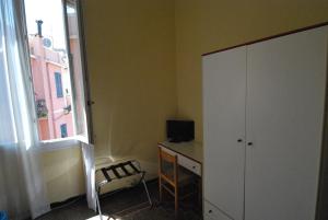 TV a/nebo společenská místnost v ubytování Albergo La Vela