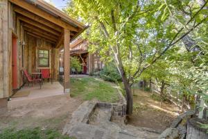 a porch of a house with a tree at Creekside Cowa-Bungalow - 61 E 200 - Studio in Moab