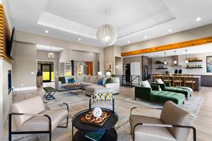 a living room with a couch and a table at Salience Path w/Heated Pool & Game Room in Mooresville
