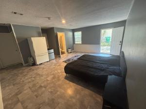 a bedroom with a bed in the middle of it at Delightful Studio, 15 mins to Downtown Atlanta in Salem West