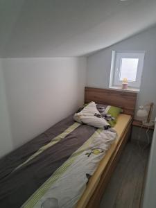 Postel nebo postele na pokoji v ubytování Apartman Viktorija
