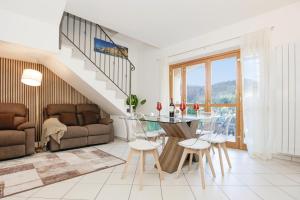 a living room with a glass table and a couch at Prestige Villa - 5 min from the train station - Garden and private Parking in Lunense