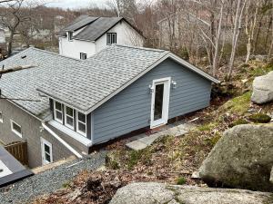 a house with a roof on top of a hill at Atlantic Oasis in Halifax