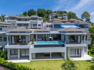 an aerial view of a house with a swimming pool at The Salin Seaview Villas in Kata Beach